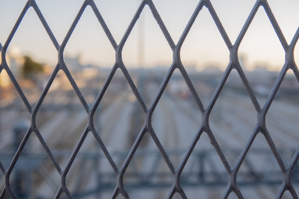 a metal fence with a chain link fence