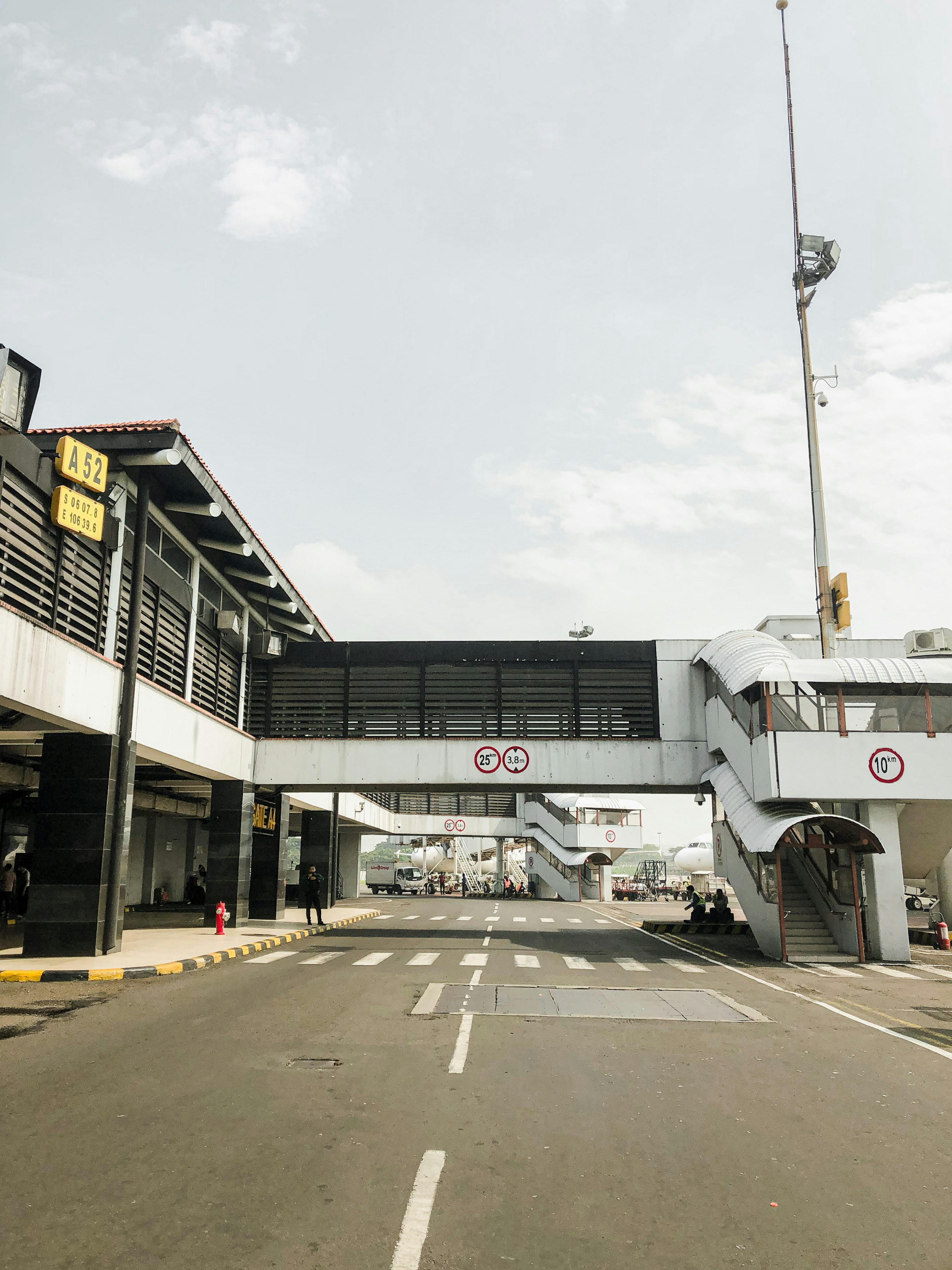 a road with a building on the side