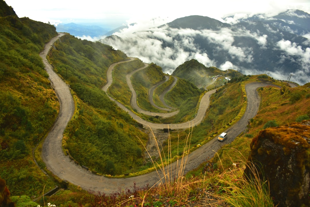 a car driving on a winding road,