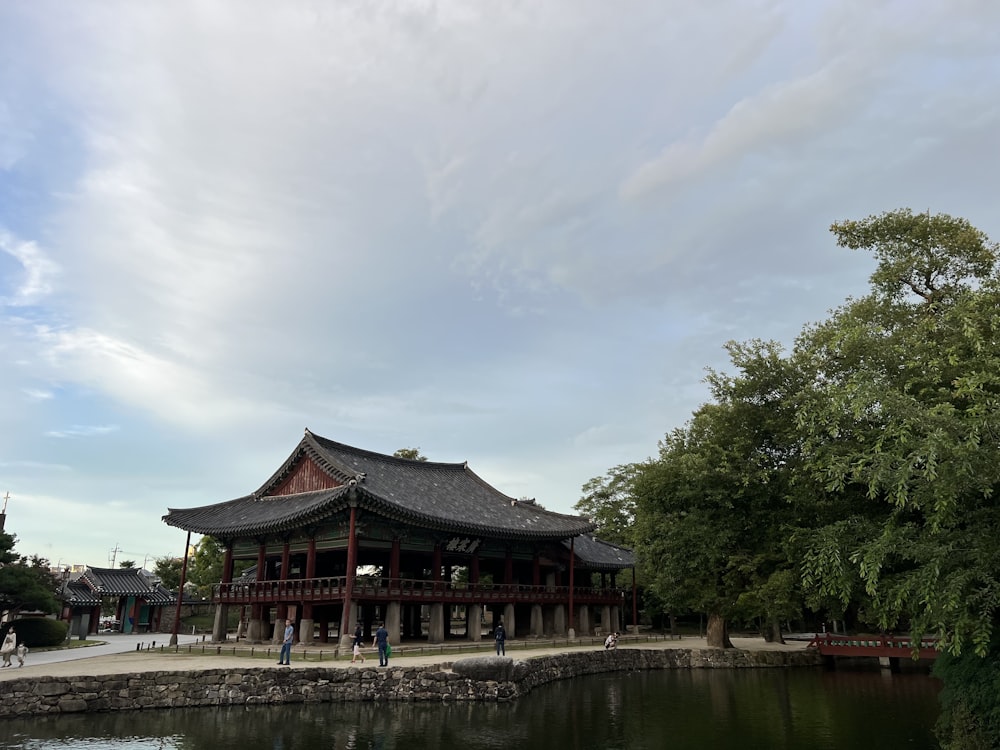 a building with a pond in front of it