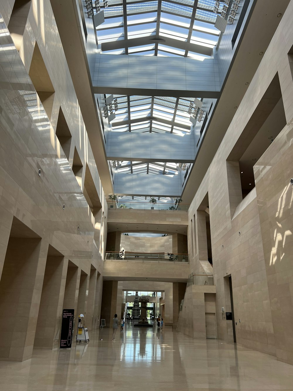 a large hallway with a glass ceiling