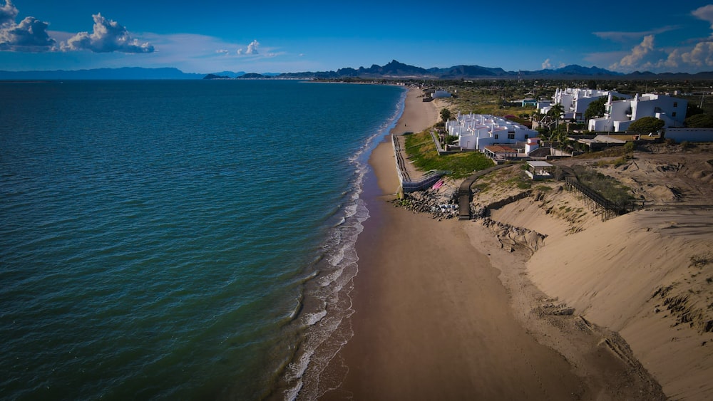 a beach with houses along it