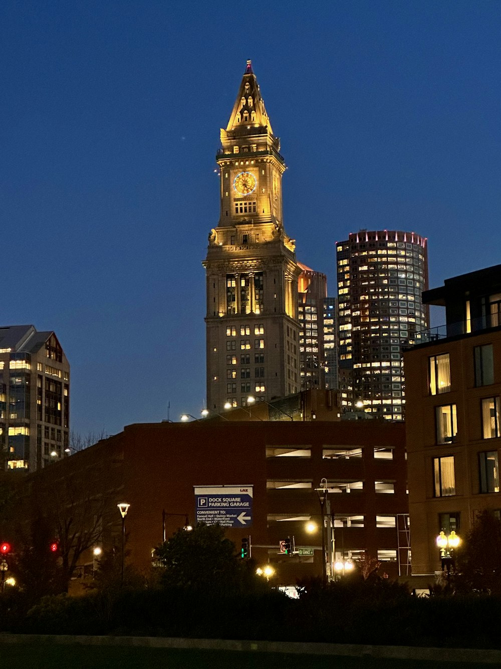 a large building towers over a city