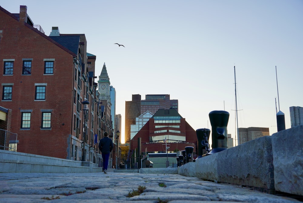 a person walking on a sidewalk