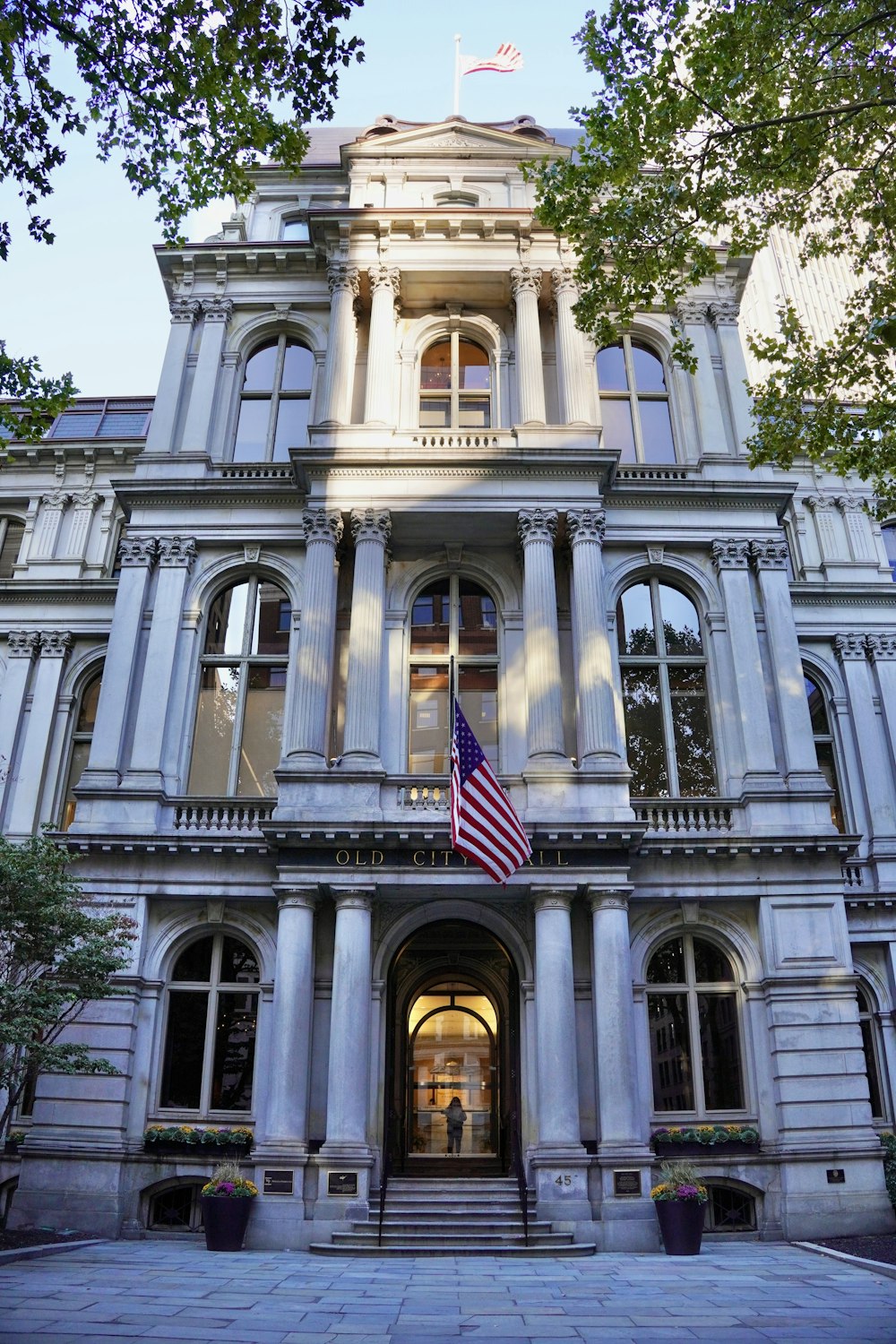 a building with columns and a flag