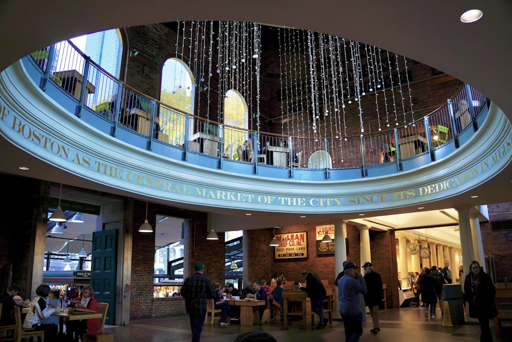 a large glass ceiling with people walking around