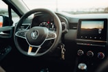 the steering wheel and dashboard of a car