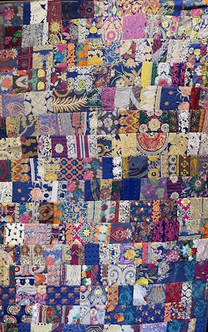 A vibrant quilt with soft textures and colors.