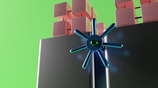 A futuristic digital illustration featuring stacked cubes in shades of pink and a large, metallic blue circular structure with radial spokes. The background is a bright green, adding a vibrant contrast.