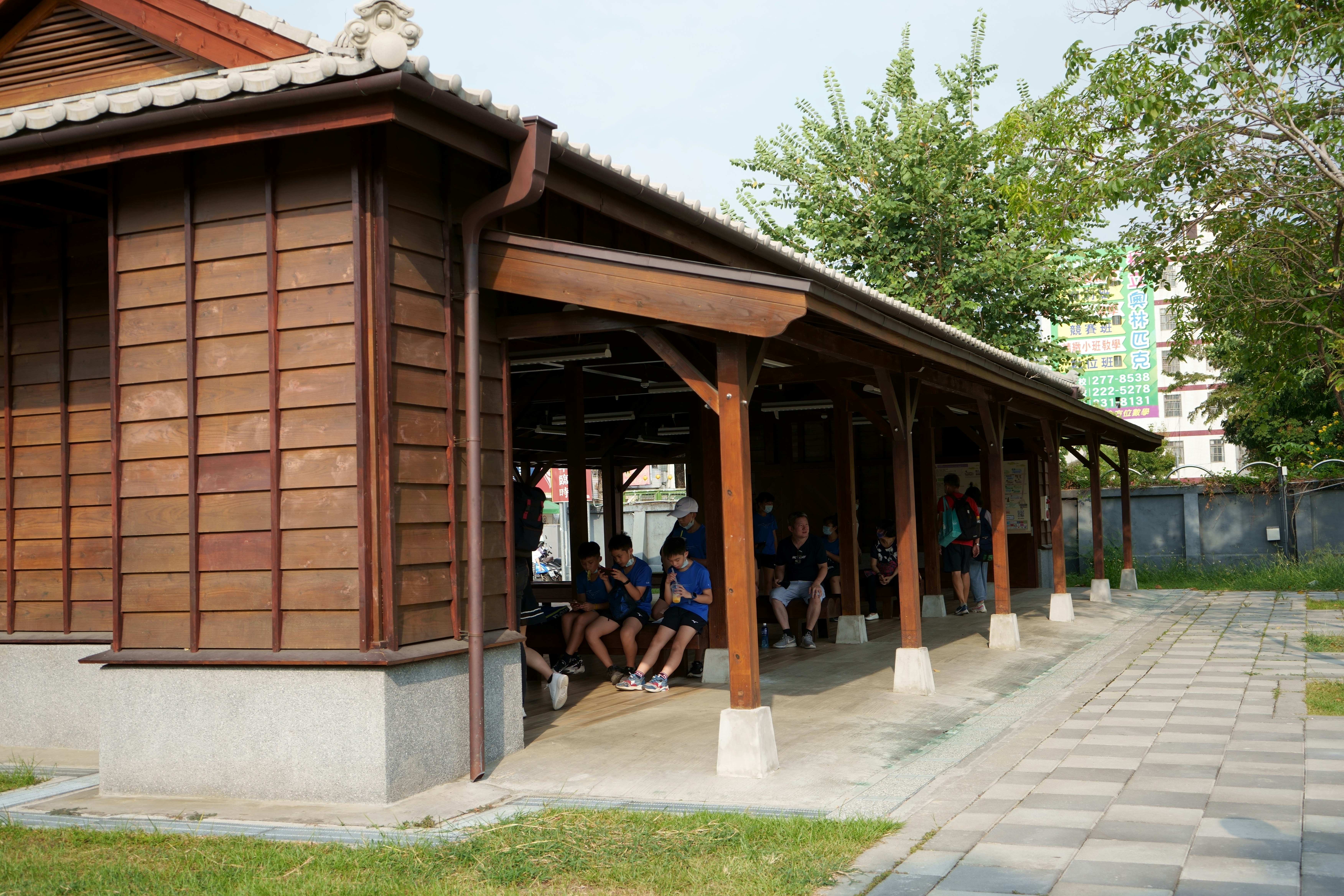 a group of people sitting outside a building