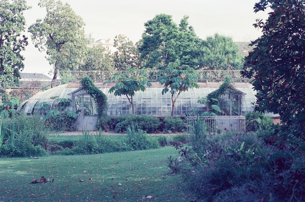 a building with trees and bushes around it