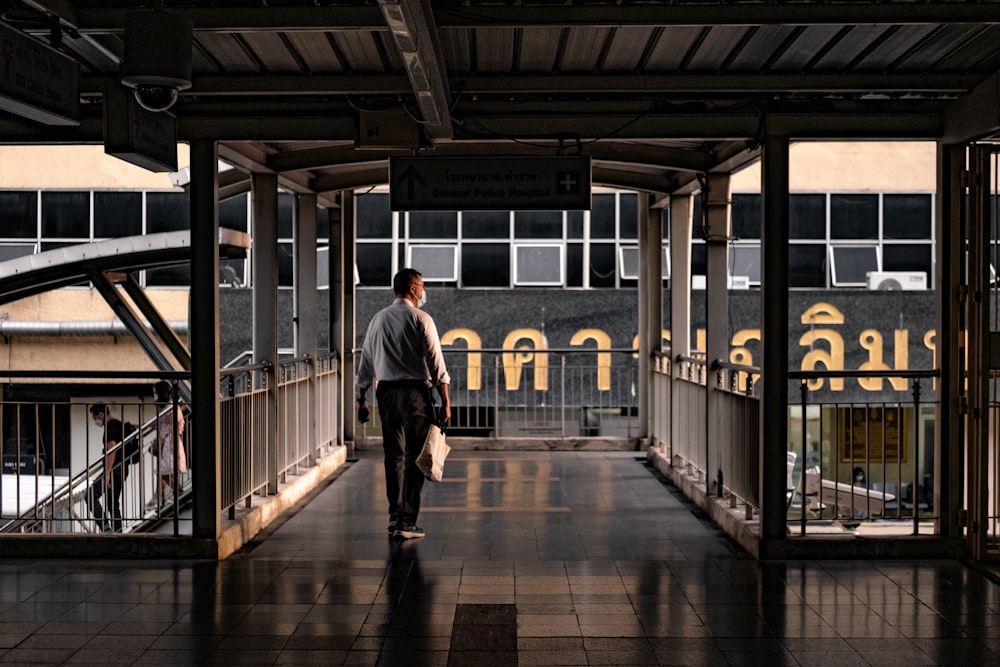 a man walking in a train station