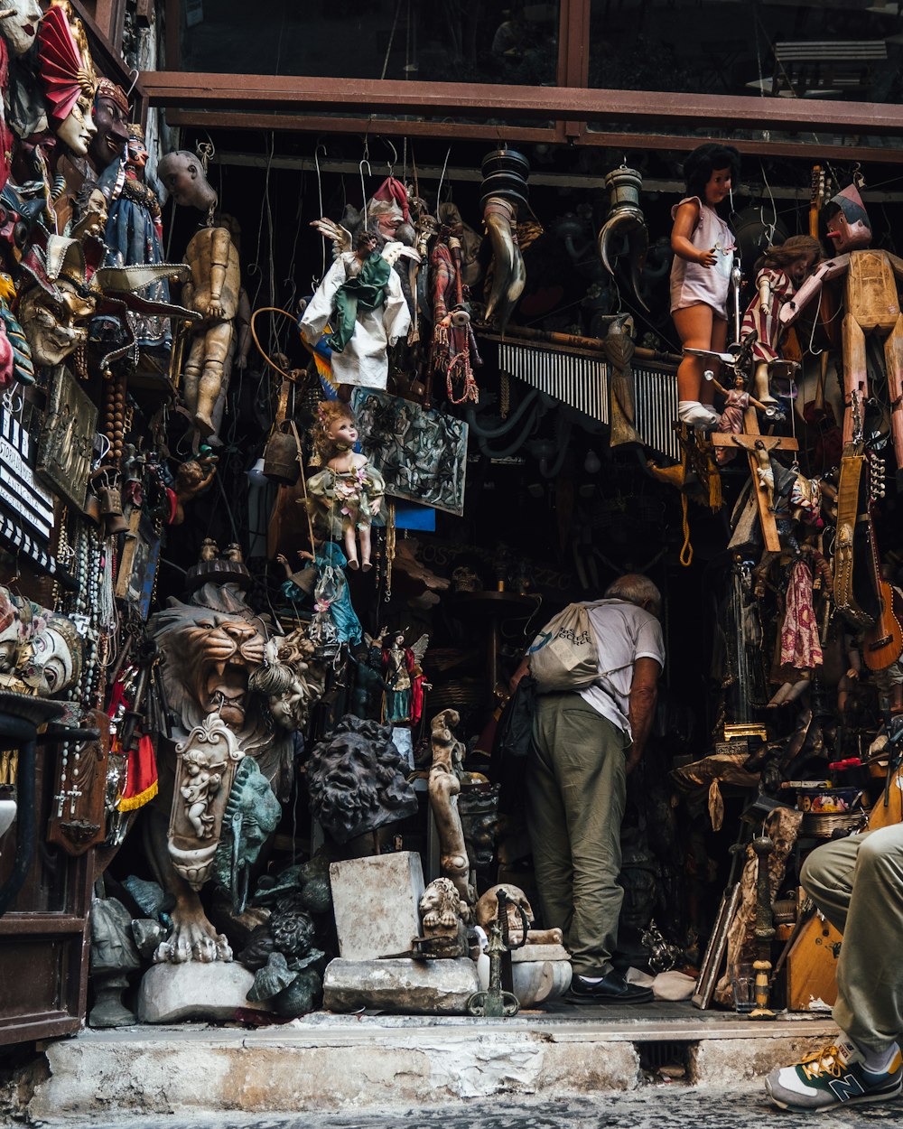 a person standing in front of a shop