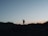 a person standing on a hill