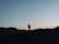 a person standing on a hill