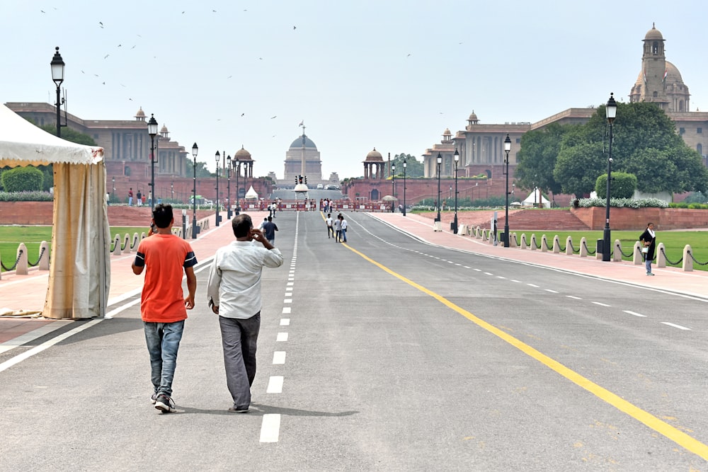 a group of people walking on a road