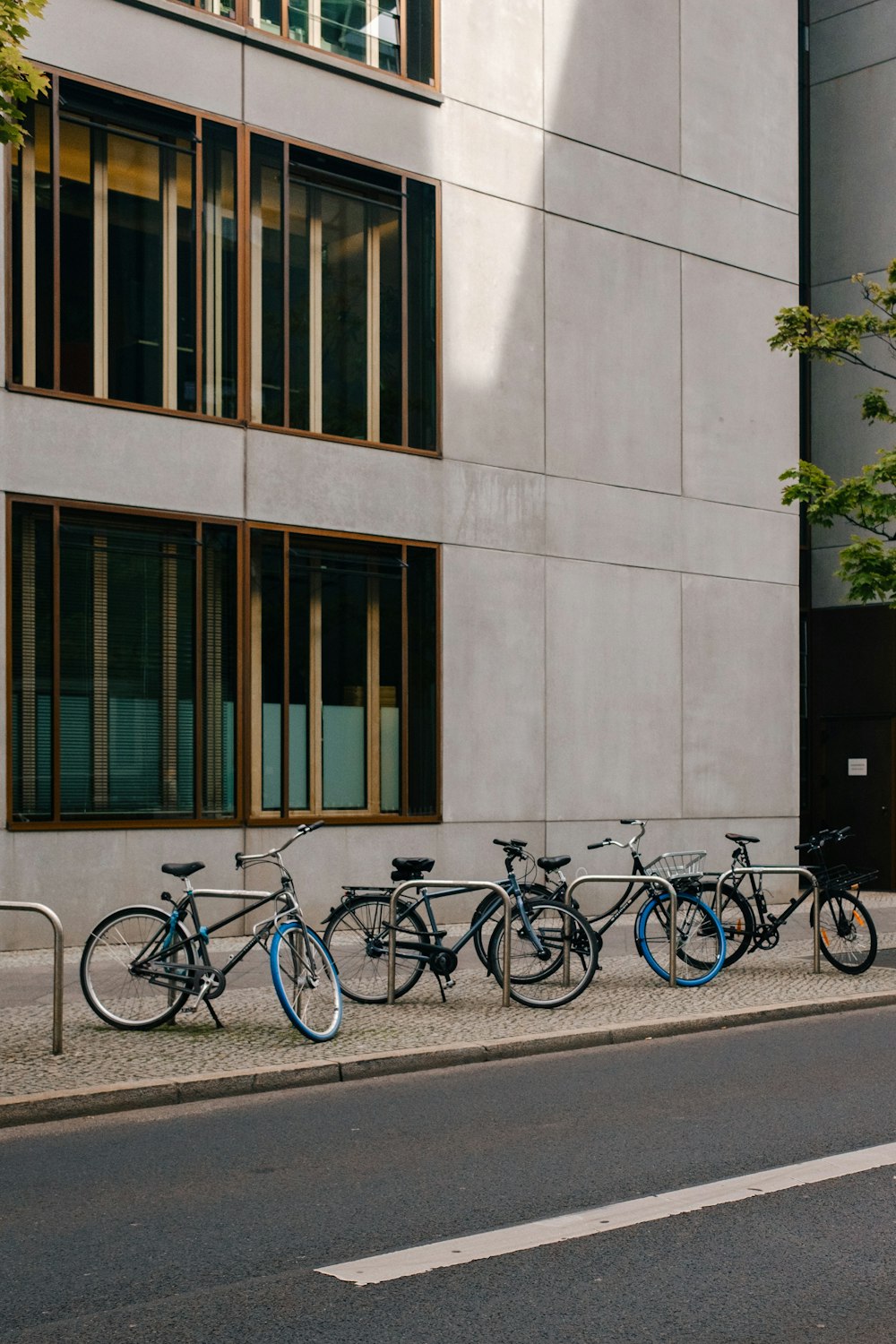 bicycles parked on the side of a building