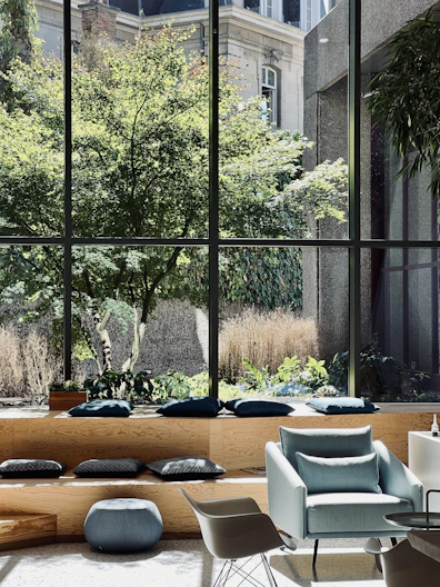 a room with a couch and chairs