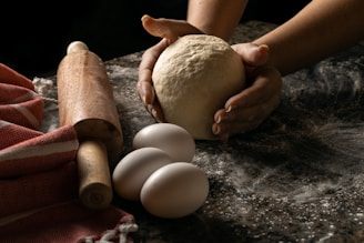 a few hands holding eggs