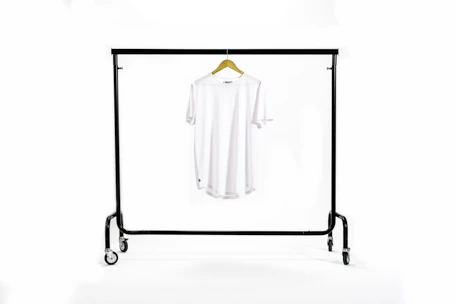 Close-up of a stylish t-shirt featuring the podlink hub logo hanging on a rack.