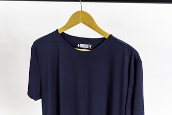 a blue t-shirt with a yellow bow