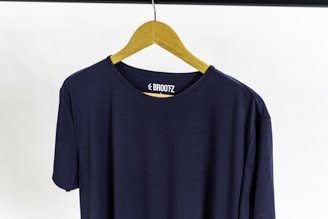 a blue t-shirt with a yellow bow