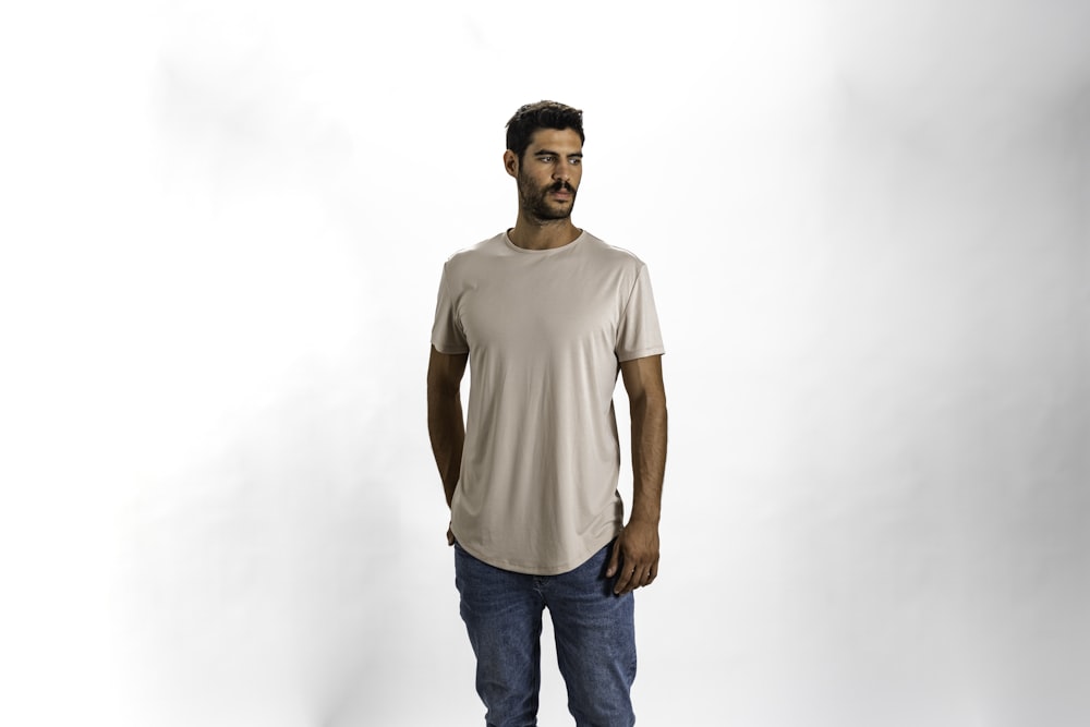 a man standing in a white shirt