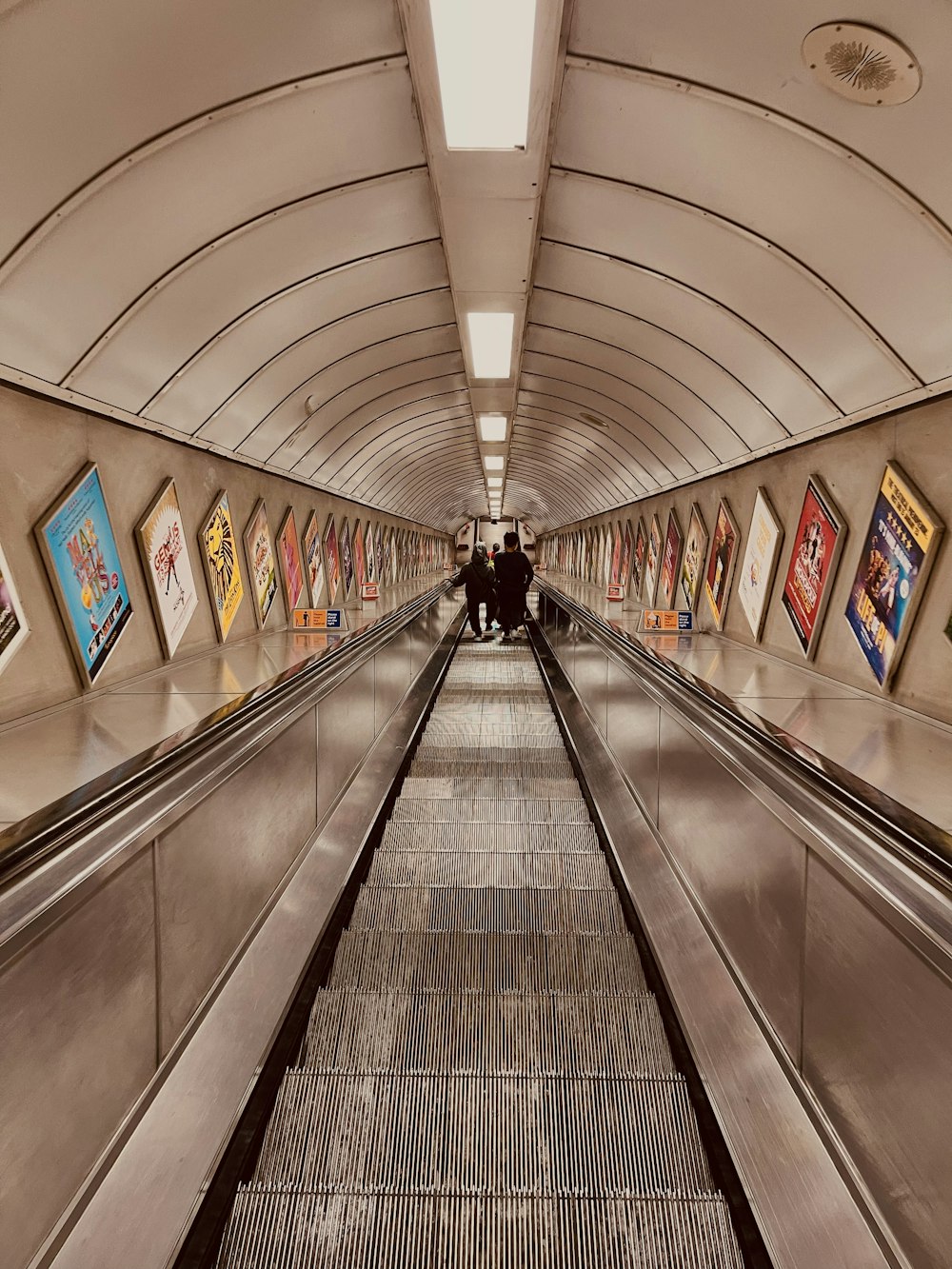 a long hallway with art on the walls