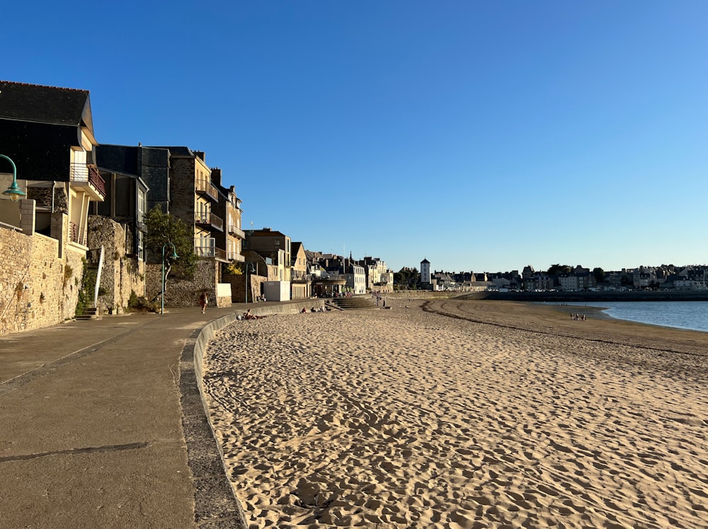 a beach with buildings along it