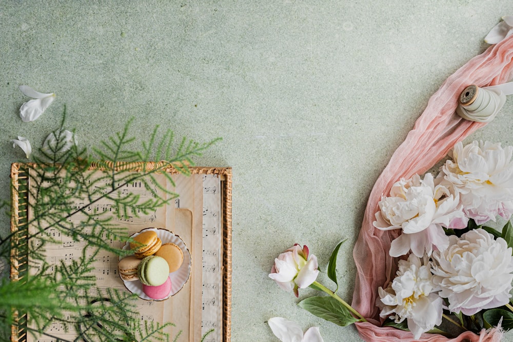 a painting of flowers and a candle