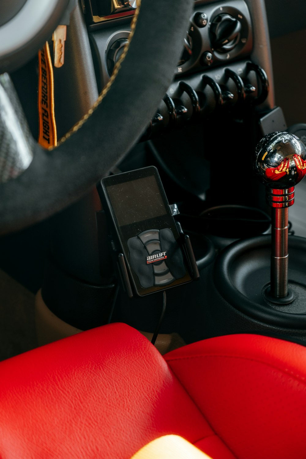 a close up of a car steering wheel and a microphone