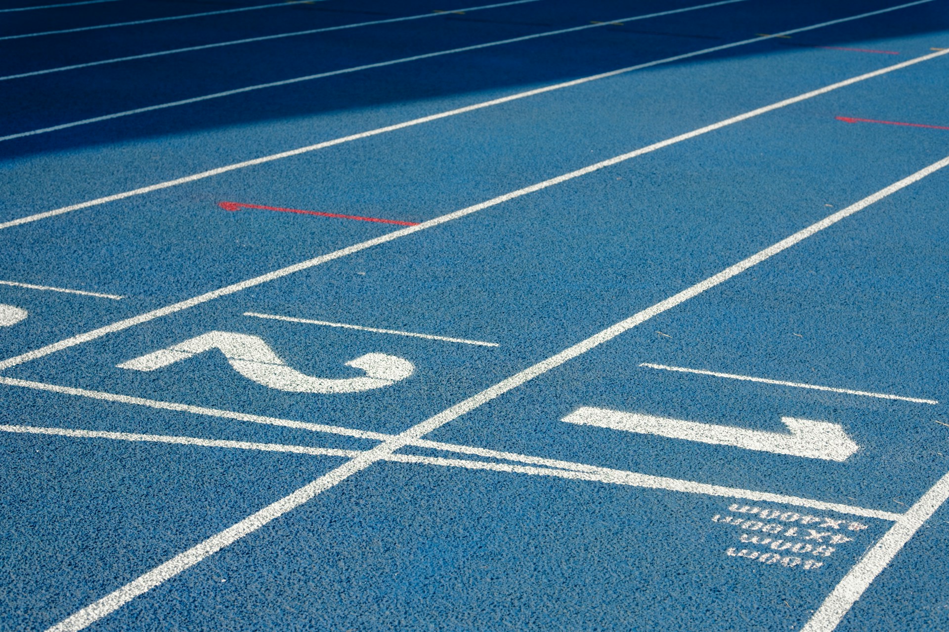 a blue track with white lines