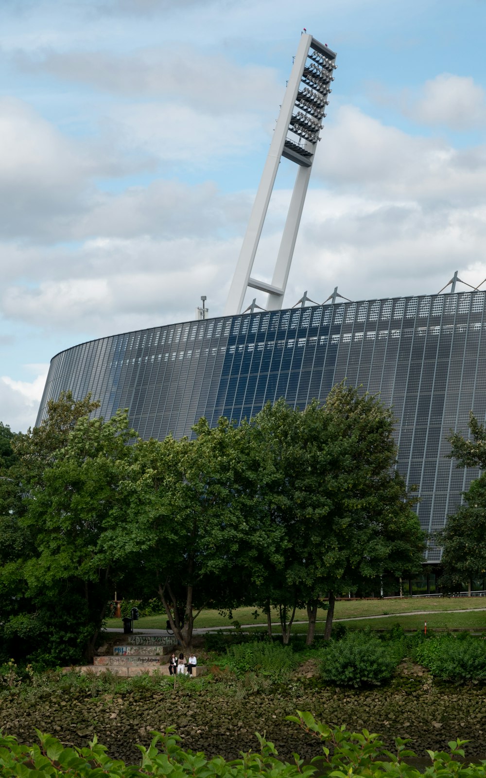 a tall building with trees in front of it