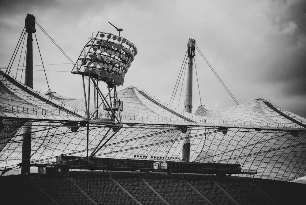 a large metal structure with a fence around it