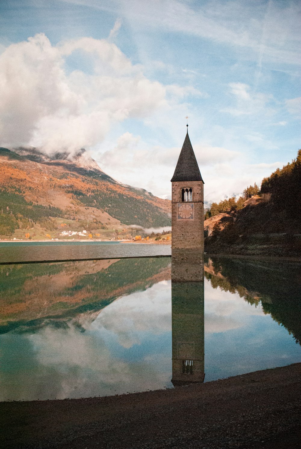 a tall tower in a lake