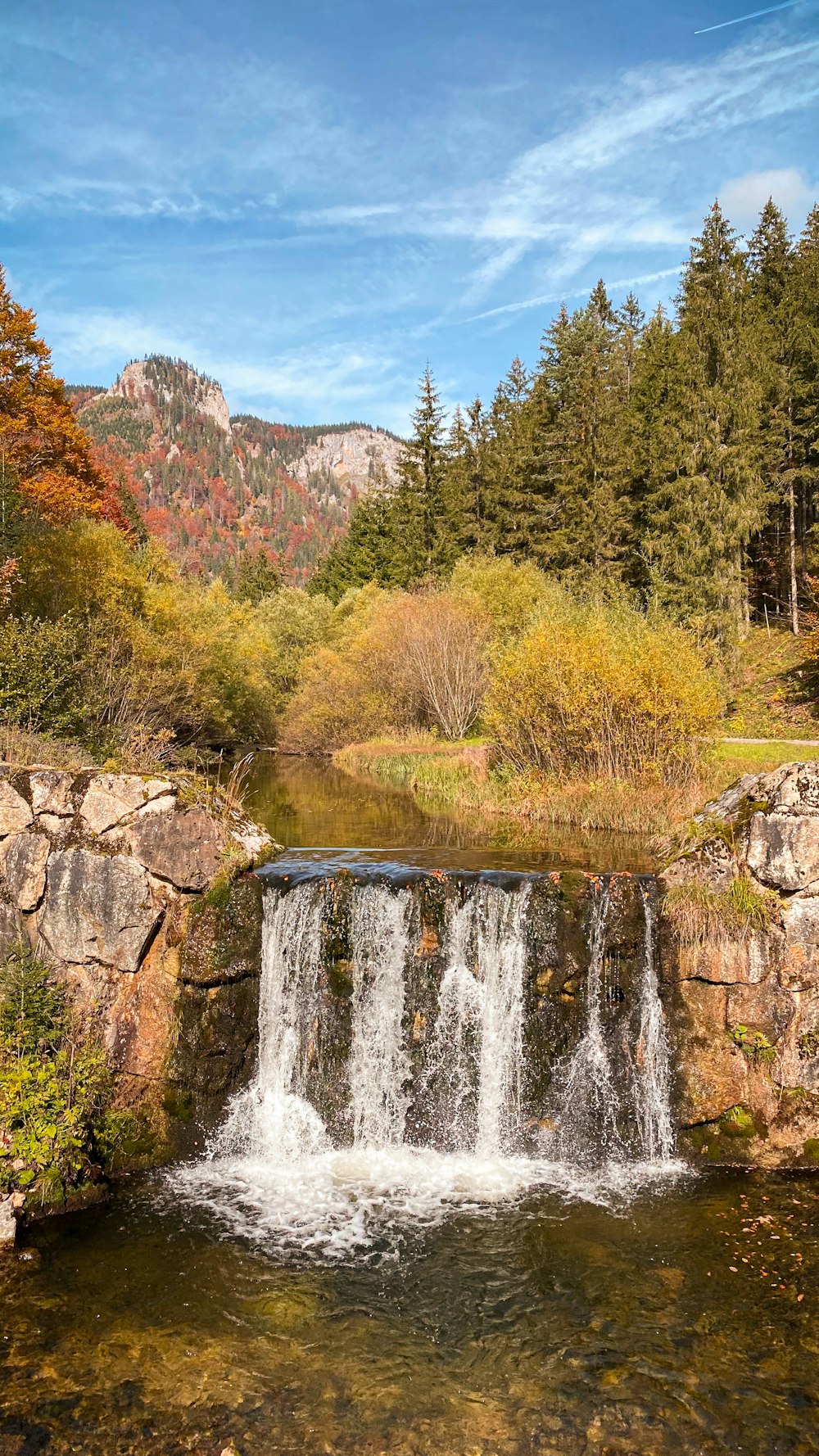 a waterfall in a forest