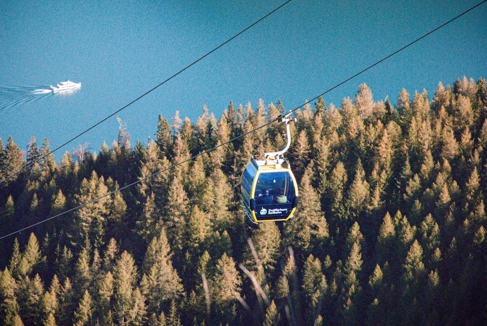 a cable car above trees