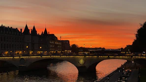 Golden sunset over Prague’s Charles Bridge with historic towers silhouetted