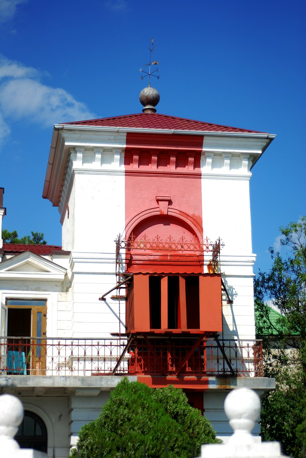 a white building with a red roof