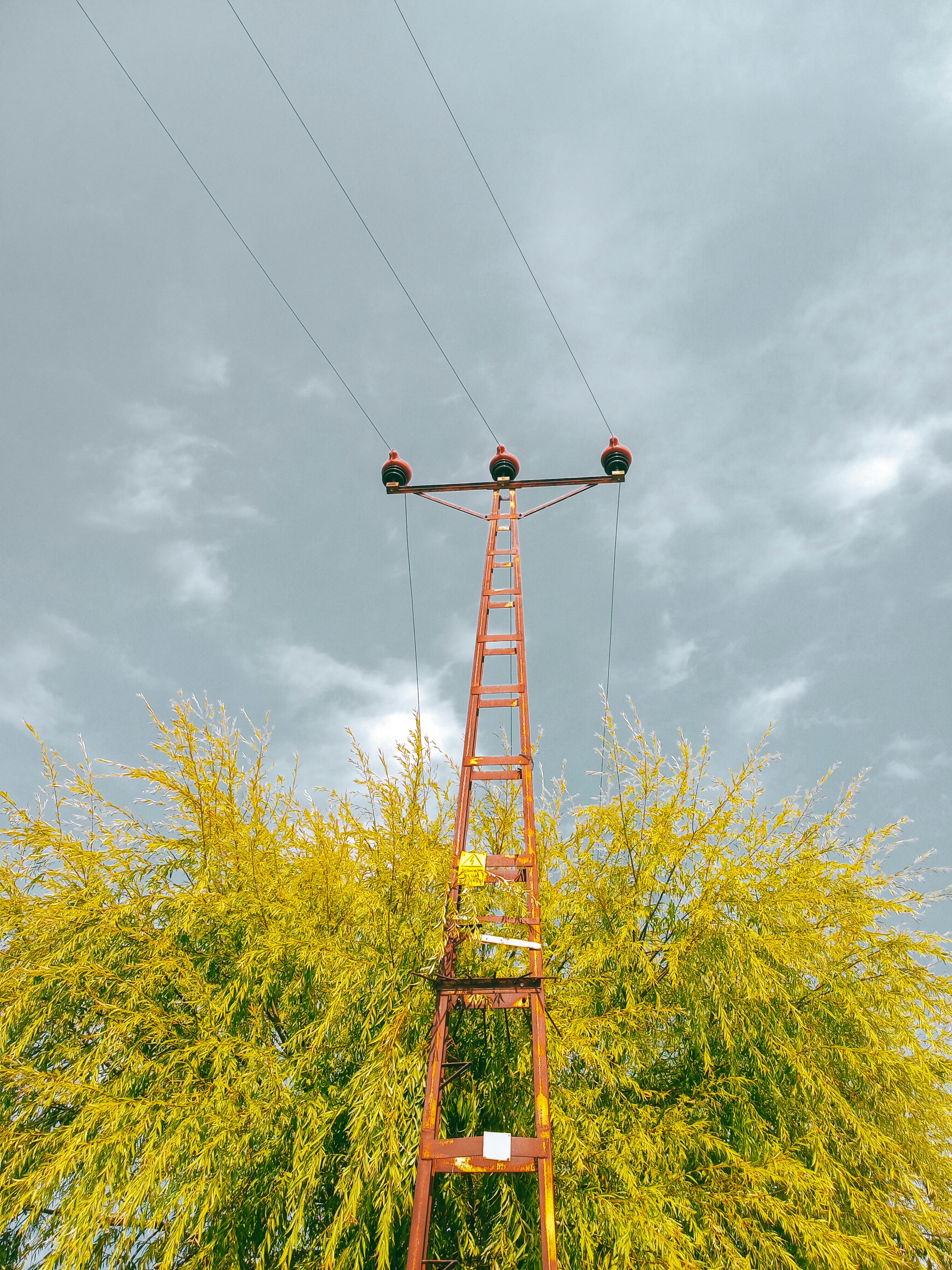 a tall tower with wires