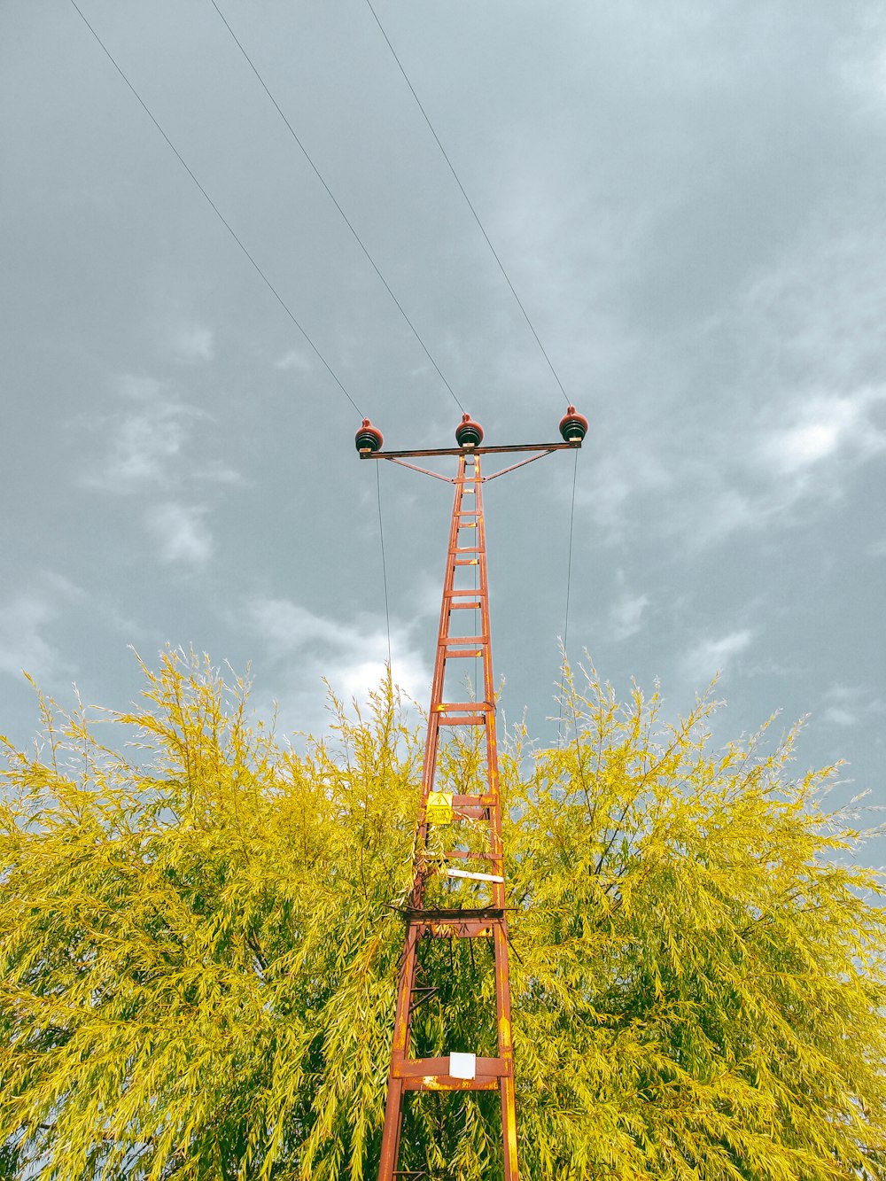 a tall tower with wires