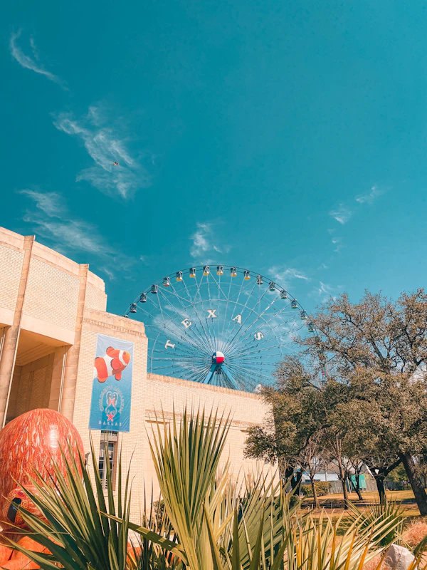 Fair Park ferris wheel behind historic Art Deco building in Dallas