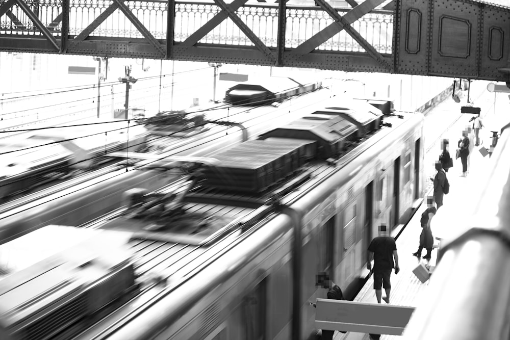 a train station with people waiting