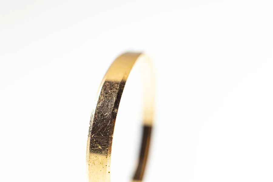 Narrow gold band on a white background