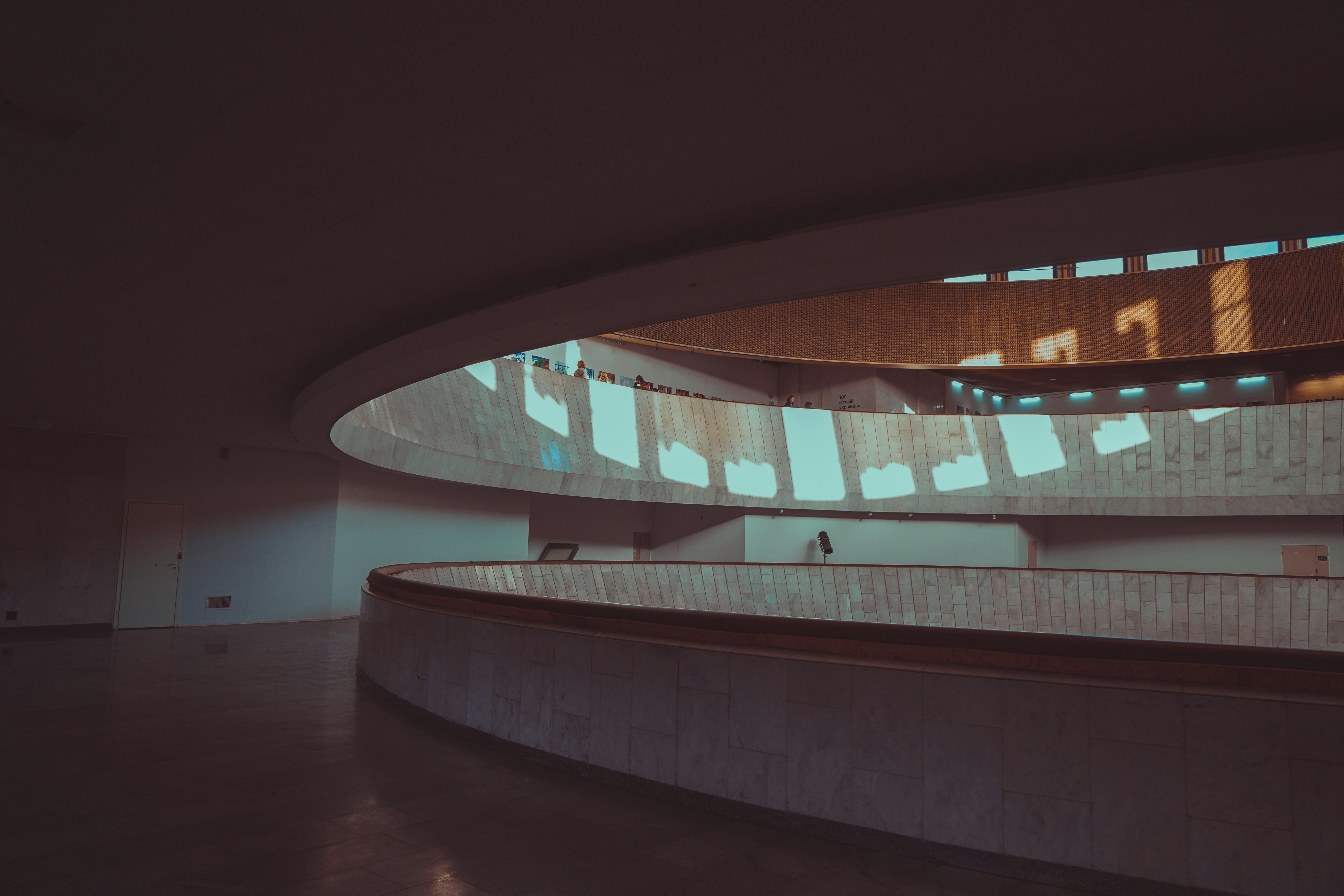  An abstract diagram illustrating an event-driven architecture, showing components communicating through events and reacting to system changes.