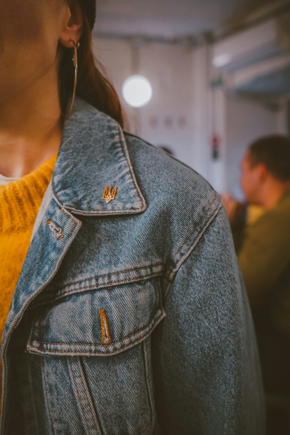 a person wearing a blue jacket