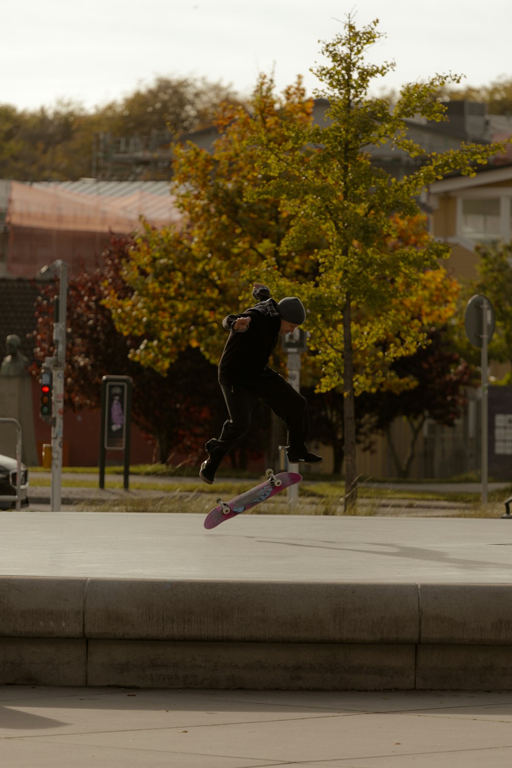 a man jumping in the air on a skateboard