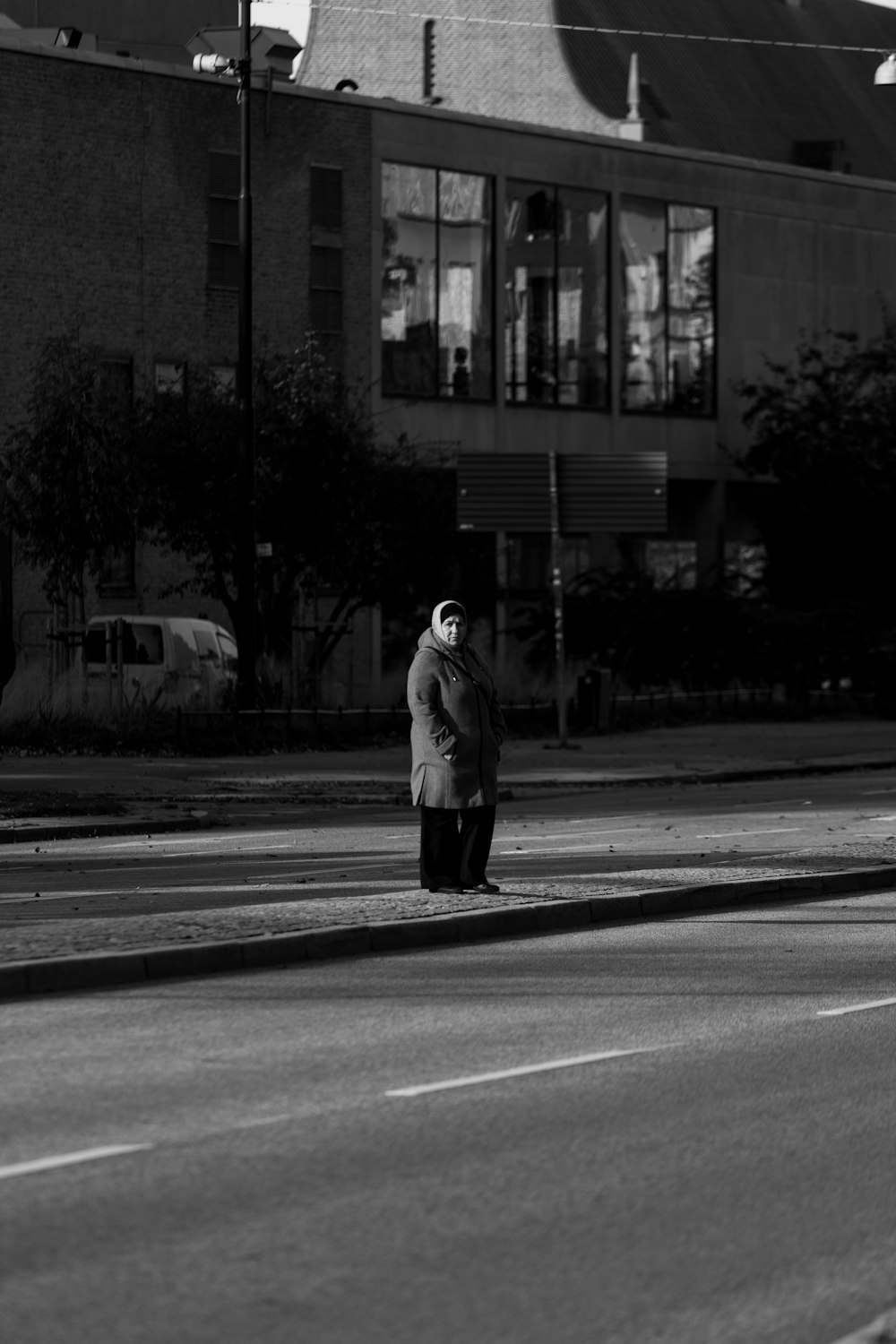 a person standing on a street corner
