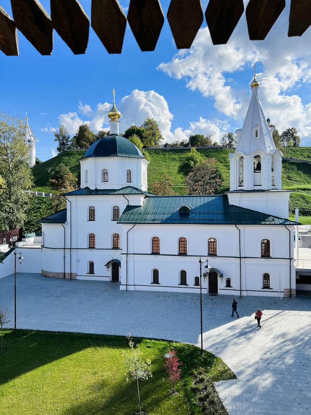 a white building with a blue roof