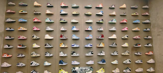 A vibrant display of colorful rubber sneakers arranged on a wooden floor, capturing the casual and lively spirit of Stridevibe.